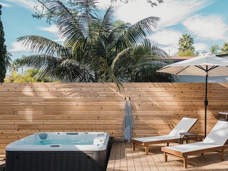 The hot tub set into the back deck